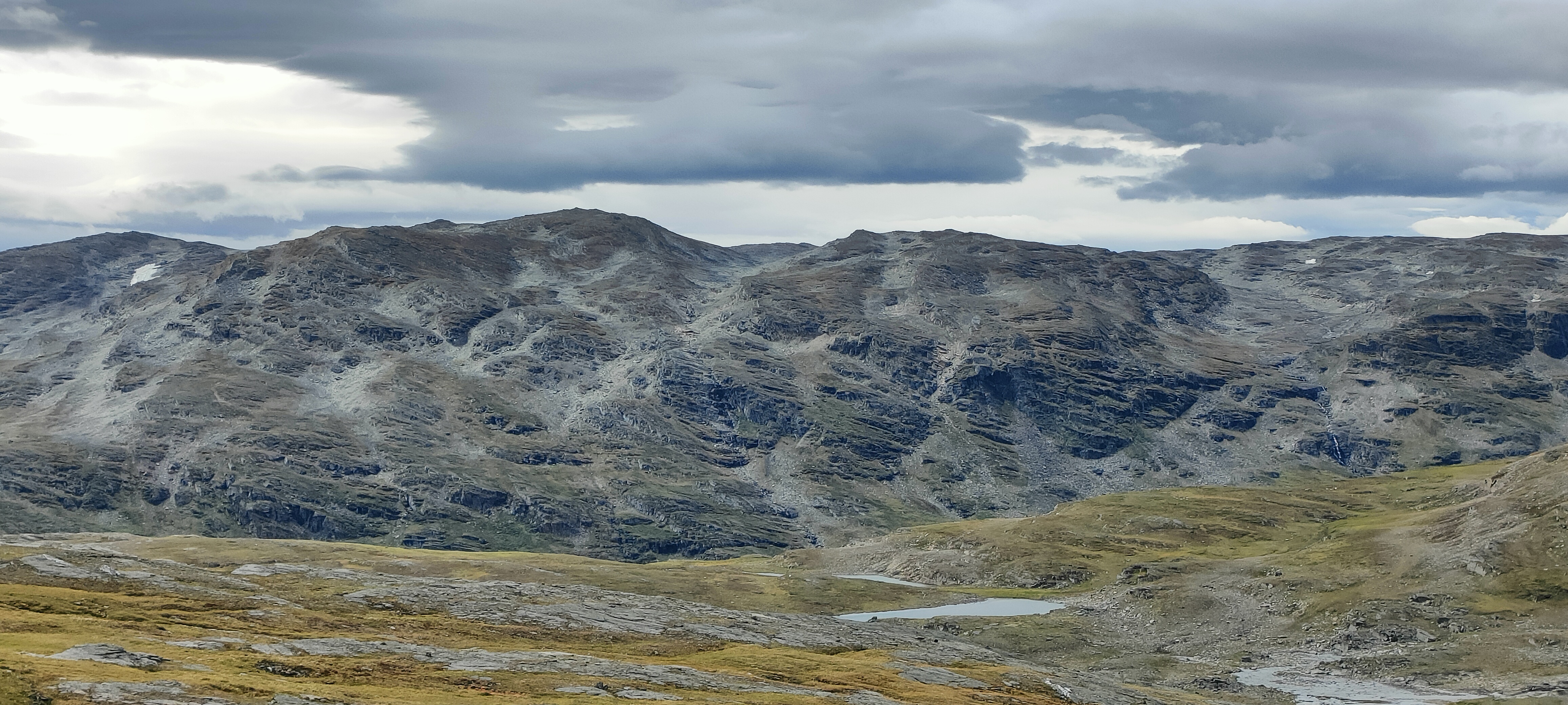 Alpine mountain landscape with scattered tarns